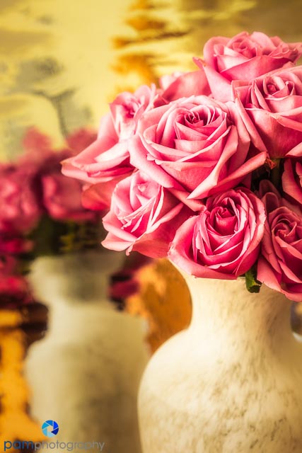 Vase of roses with reflection in Mylar